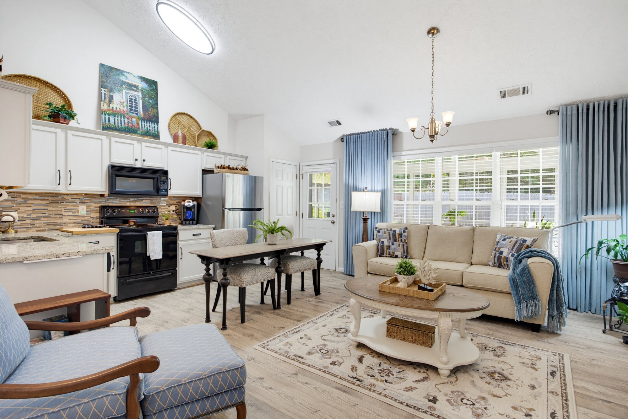 Open living, dining, and kitchen spaces